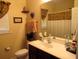Bathroom with a vanity and a large mirror, a toilet, and a shower with curtain at 9677 Islesworth Way, Summerville, SC 29485