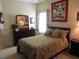 Bedroom featuring a decorative quilt, a wooden dresser, and a cozy design at 9677 Islesworth Way, Summerville, SC 29485