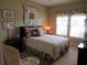 Bedroom featuring floral accents, a quilt, and a comfortable seating area at 9677 Islesworth Way, Summerville, SC 29485