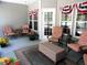 Covered patio features furniture, decor, potted plants, and an ottoman at 9677 Islesworth Way, Summerville, SC 29485