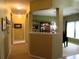 Bright hallway leading to rooms with hardwood and carpeted floors at 9677 Islesworth Way, Summerville, SC 29485