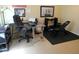 View of a home office and workout space features desks, office chair, computer, weight bench and free weights at 9677 Islesworth Way, Summerville, SC 29485