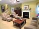 Inviting living room with a fireplace, comfortable seating and seamless flow for entertaining at 9677 Islesworth Way, Summerville, SC 29485