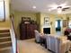 Spacious living room with a fireplace, offering a cozy space for relaxation at 9677 Islesworth Way, Summerville, SC 29485