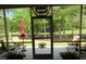 Inviting screened patio with outdoor furniture, offering serene views of the lush greenery at 9677 Islesworth Way, Summerville, SC 29485