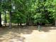 Picturesque picnic area featuring multiple picnic tables nestled amidst lush green trees, ideal for outdoor gatherings at 9677 Islesworth Way, Summerville, SC 29485