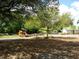 Brightly colored playground with slides and play equipment surrounded by greenery, perfect for Gathering fun at 9677 Islesworth Way, Summerville, SC 29485