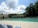 Large community swimming pool with lounge chairs and shade arbors providing a resort-like experience at 9677 Islesworth Way, Summerville, SC 29485
