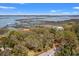 Expansive aerial view showcases waterfront community with picturesque docks and stunning water views at 1214 Tabby Dr, Folly Beach, SC 29439