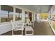 Inviting back porch offering plenty of seating for relaxation and outdoor enjoyment at 1214 Tabby Dr, Folly Beach, SC 29439