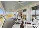 Expansive back porch with water views, ceiling fans, and comfortable outdoor seating at 1214 Tabby Dr, Folly Beach, SC 29439