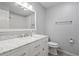 Elegant bathroom featuring marble countertop, white cabinets, and modern fixtures at 1214 Tabby Dr, Folly Beach, SC 29439