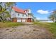 Inviting home with a brick foundation, red roof, three-car garage, and a picturesque waterfront view at 1214 Tabby Dr, Folly Beach, SC 29439