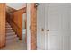 Inviting foyer with paneled walls, brick accents, and staircase at 1214 Tabby Dr, Folly Beach, SC 29439