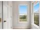 Bright hallway with natural light showcases scenic water views from the windows at 1214 Tabby Dr, Folly Beach, SC 29439