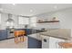 Charming kitchen featuring stainless steel appliances and light countertops paired with blue cabinets at 1214 Tabby Dr, Folly Beach, SC 29439