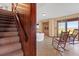 Cozy living room features hardwood floors, exposed brick, and scenic waterfront views at 1214 Tabby Dr, Folly Beach, SC 29439