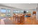 Sunlit living room boasts hardwood floors, water views, and a seamless indoor-outdoor flow at 1214 Tabby Dr, Folly Beach, SC 29439