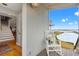 Side porch with view of waterway, stairs, and rocking chair at 1214 Tabby Dr, Folly Beach, SC 29439