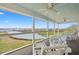 Enjoy a spacious porch with ceiling fans and beautiful waterfront views at 1214 Tabby Dr, Folly Beach, SC 29439