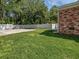 Spacious backyard featuring a well-maintained lawn, concrete patio, and a privacy fence at 103 Sycamore Dr, Summerville, SC 29485