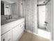 Bathroom with white vanity and shower-tub combo at 103 Sycamore Dr, Summerville, SC 29485