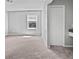 Bedroom with neutral carpet, a large window providing natural light, and a closet for storage at 103 Sycamore Dr, Summerville, SC 29485