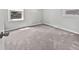 Bedroom featuring neutral walls, plush carpeting, and natural light from two windows at 103 Sycamore Dr, Summerville, SC 29485