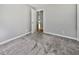 This is a neutral bedroom with plush gray carpeting at 103 Sycamore Dr, Summerville, SC 29485