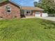 Charming brick home featuring a manicured front lawn and an attached single car garage at 103 Sycamore Dr, Summerville, SC 29485