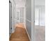 Hallway with hardwood floors and neutral paint that connects multiple rooms within the home at 103 Sycamore Dr, Summerville, SC 29485