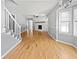 An open-concept living room features hardwood floors and a charming fireplace at 103 Sycamore Dr, Summerville, SC 29485