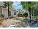 Backyard features mature trees, lush landscaping, and stone pathway creating a peaceful and private outdoor area at 106 Sago Palm Ct, Summerville, SC 29483