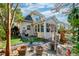 Landscaped backyard with a stone pathway, an artificial turf area, and a charming outdoor living space at 106 Sago Palm Ct, Summerville, SC 29483