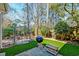 Outdoor space featuring artificial turf, a grill, and landscaping perfect for relaxation and entertaining at 106 Sago Palm Ct, Summerville, SC 29483