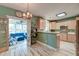 Open kitchen showcasing the connection to the sunroom and featuring ample counter space and modern appliances at 106 Sago Palm Ct, Summerville, SC 29483