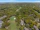 An aerial image of the real estate offers a glimpse into its lush surroundings and golf course views at 108 High Hammock Villas Dr, Seabrook Island, SC 29455