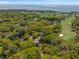 A beautiful aerial view of real estate in a lush golf community near the water at 108 High Hammock Villas Dr, Seabrook Island, SC 29455