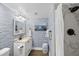 Charming bathroom featuring blue wallpaper, a vanity with a sink, and a shower with a white shower curtain at 108 High Hammock Villas Dr, Seabrook Island, SC 29455