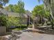 Tan condominium complex exterior with stairs to the elevated porch from the parking lot at 108 High Hammock Villas Dr, Seabrook Island, SC 29455