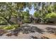 Exterior view of condo complex and parking lot with mature trees and Spanish moss at 108 High Hammock Villas Dr, Seabrook Island, SC 29455