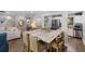 Open concept with kitchen, dining area, bar, and living room at 108 High Hammock Villas Dr, Seabrook Island, SC 29455