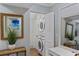 Neat laundry area with stacked washer/dryer unit and storage at 108 High Hammock Villas Dr, Seabrook Island, SC 29455