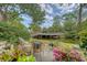 Charming backyard patio with stylish outdoor seating and views of the community boardwalk and pond at 1134 Shadow Lake Cir # 55, Mount Pleasant, SC 29464