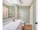 Updated bathroom featuring a large mirror, modern lighting fixtures, and a spacious vanity at 1134 Shadow Lake Cir # 55, Mount Pleasant, SC 29464