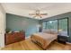 Bedroom with hardwood floors, large window with backyard view, and dresser at 1134 Shadow Lake Cir # 55, Mount Pleasant, SC 29464