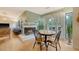 Open concept dining area featuring hardwood floors, a fireplace, and adjacent seating area at 1134 Shadow Lake Cir # 55, Mount Pleasant, SC 29464