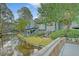 Beautiful waterfront home showcasing picturesque views of the serene lagoon and manicured lawn at 1134 Shadow Lake Cir # 55, Mount Pleasant, SC 29464