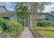 Charming two-story home with a serene walkway leading to the front door, surrounded by lush landscaping at 1134 Shadow Lake Cir # 55, Mount Pleasant, SC 29464