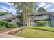 Home exterior featuring mature trees, landscaping, and a well-maintained lawn at 1134 Shadow Lake Cir # 55, Mount Pleasant, SC 29464